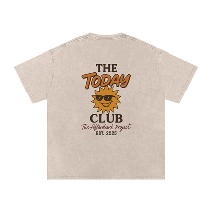 Beige t-shirt with 'The Today Club' logo and text on a white background